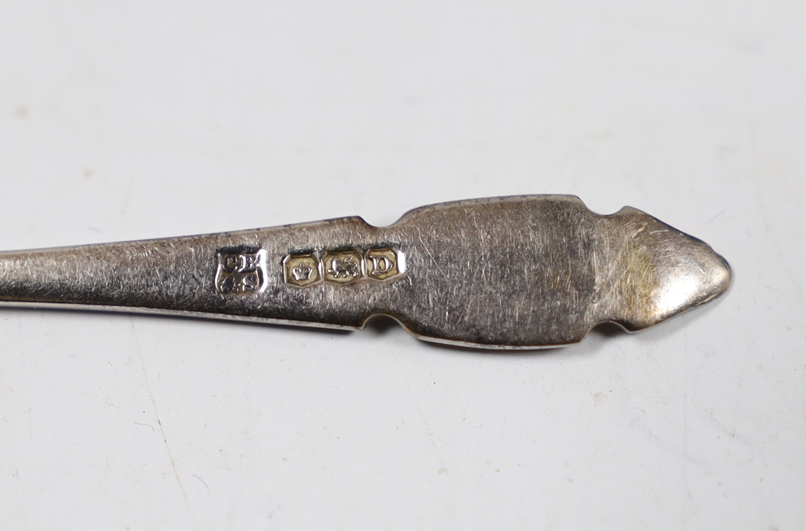 A cased set of twelve Edwardian silver teaspoons with tongs, William Hutton & Sons, London, 1905 and a cased set of five coffee spoons.